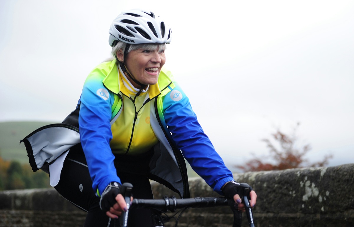 Active older woman cycling outdoors